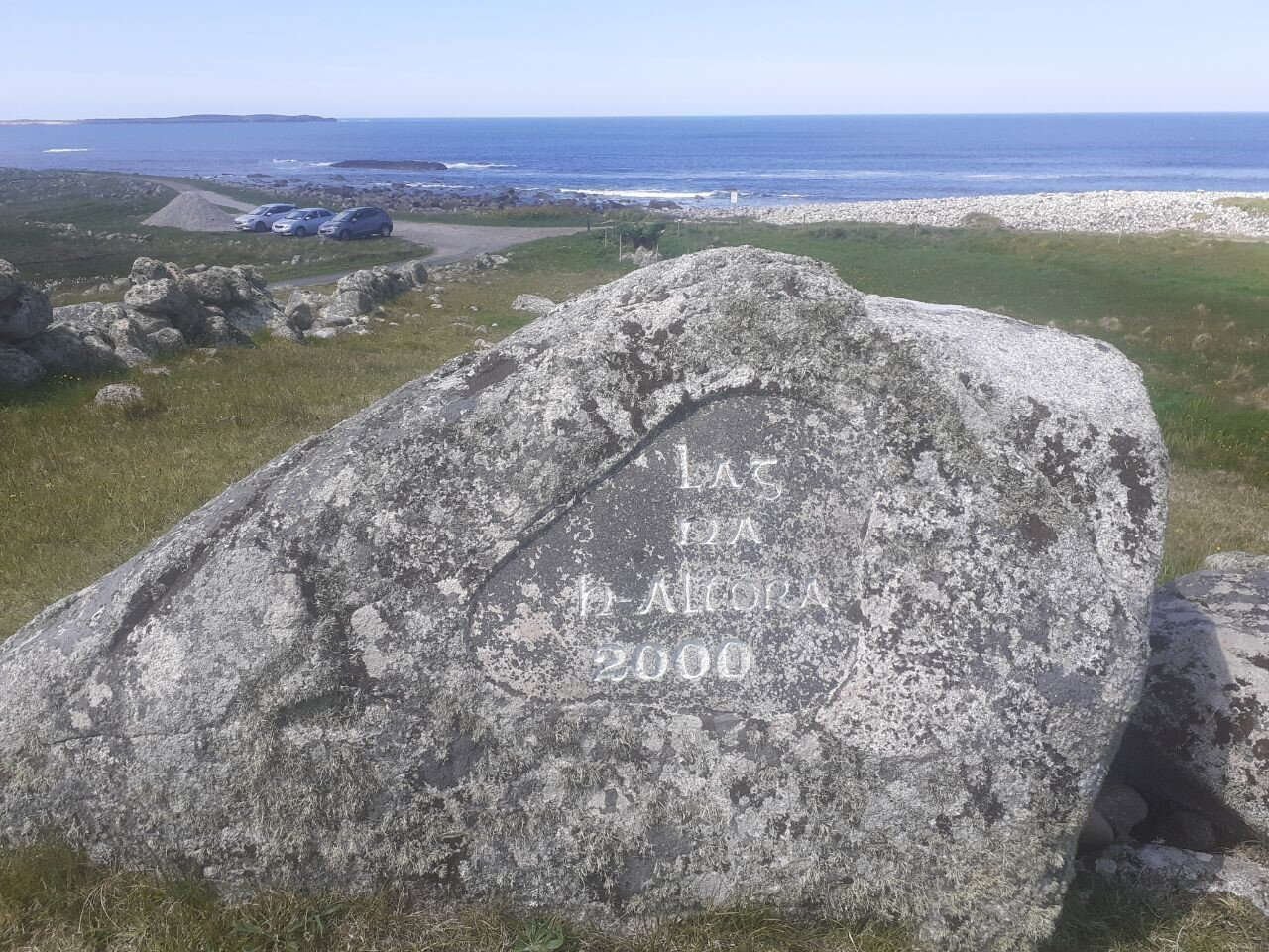 Inscribed coastal Mass Rock overlooking the sea
