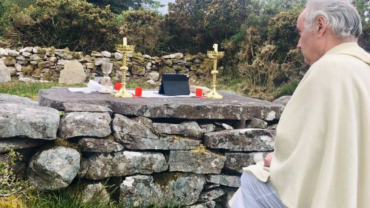 Fr Kieran O’Rourke prays beside the altar at Loughatorick Mass Rock