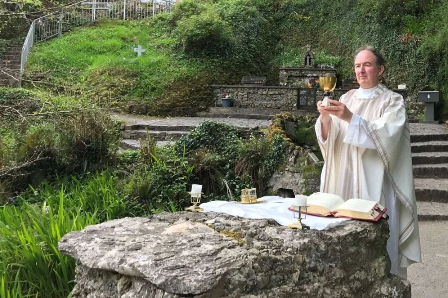 Fr Jim Murray celebrates Mass at the Holy Well