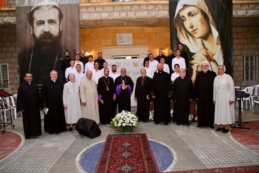 Seminarians standing and smiling for a photo
