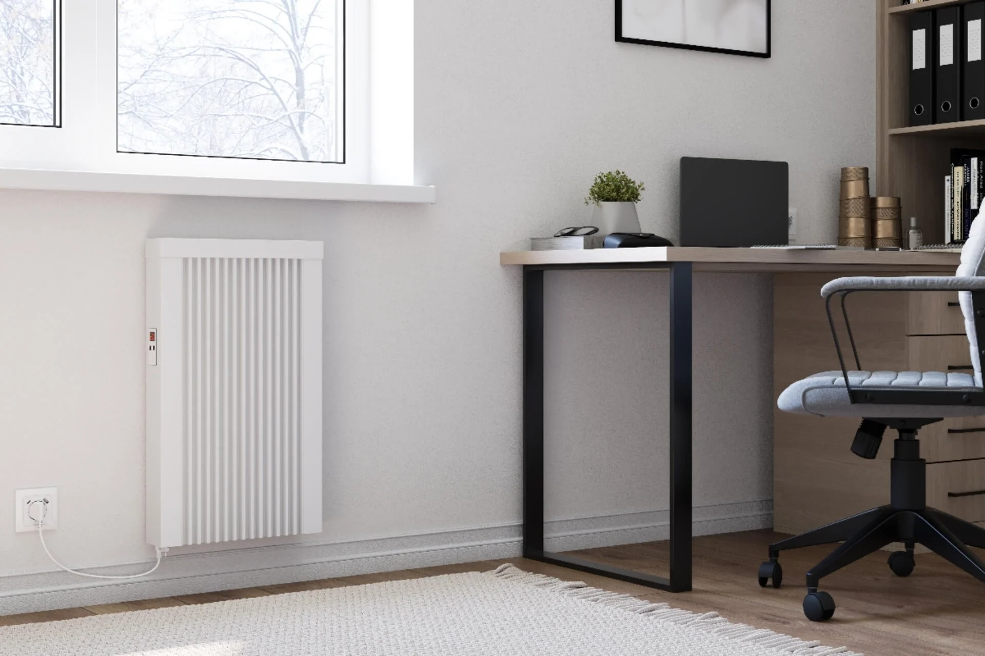 Home office with a white radiator, window showing snow outside, a desk with a laptop, plant, phone, and office supplies, and an ergonomic office chair.