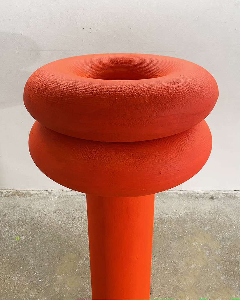 UNTITLED, column sculpture in orange-red