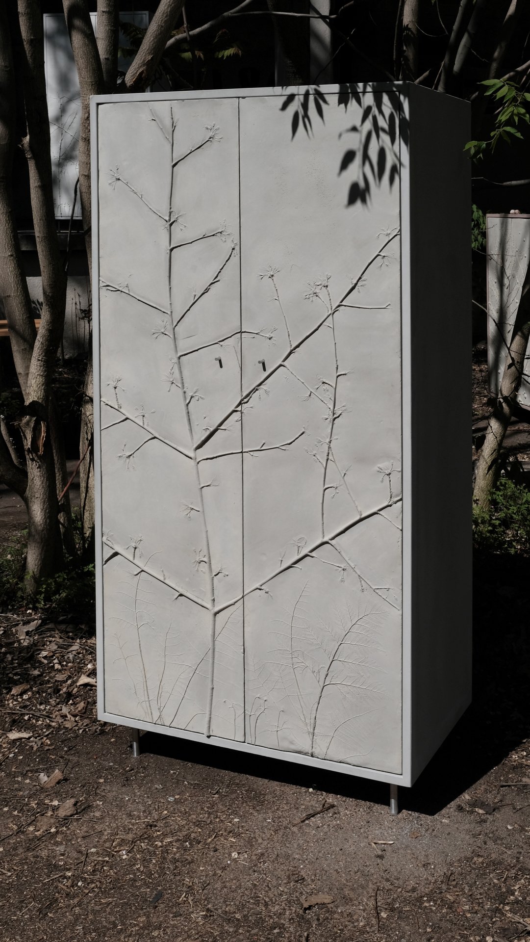 CHERRY TREE, tall concrete cabinet
