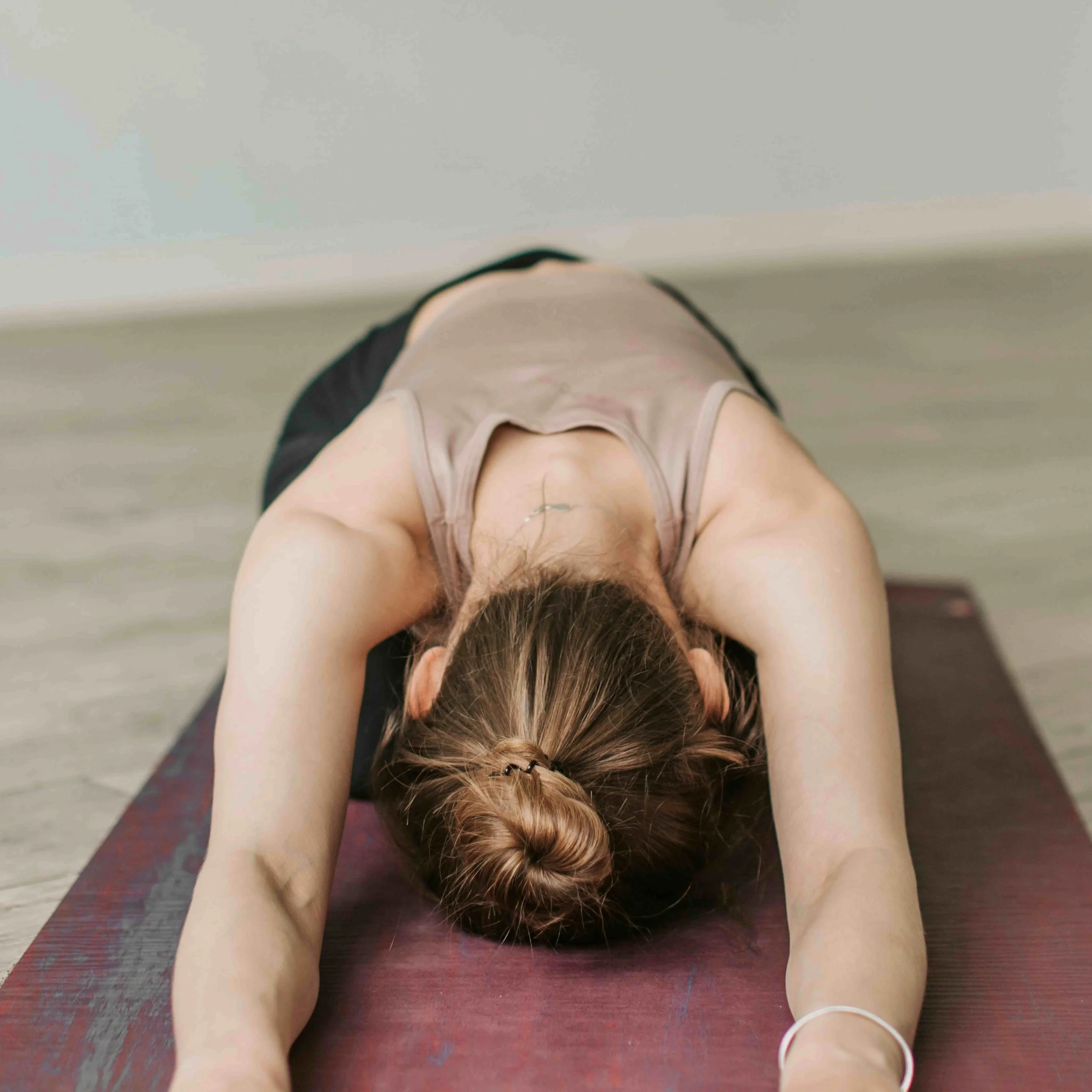 person in extended child's pose