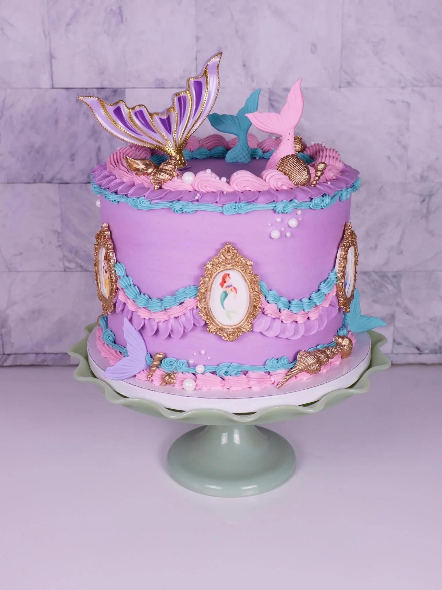 Princess cake with an emphasis on Ariel 👑🧜🏻&zwj;♀️

Cake design @icedbytaylor