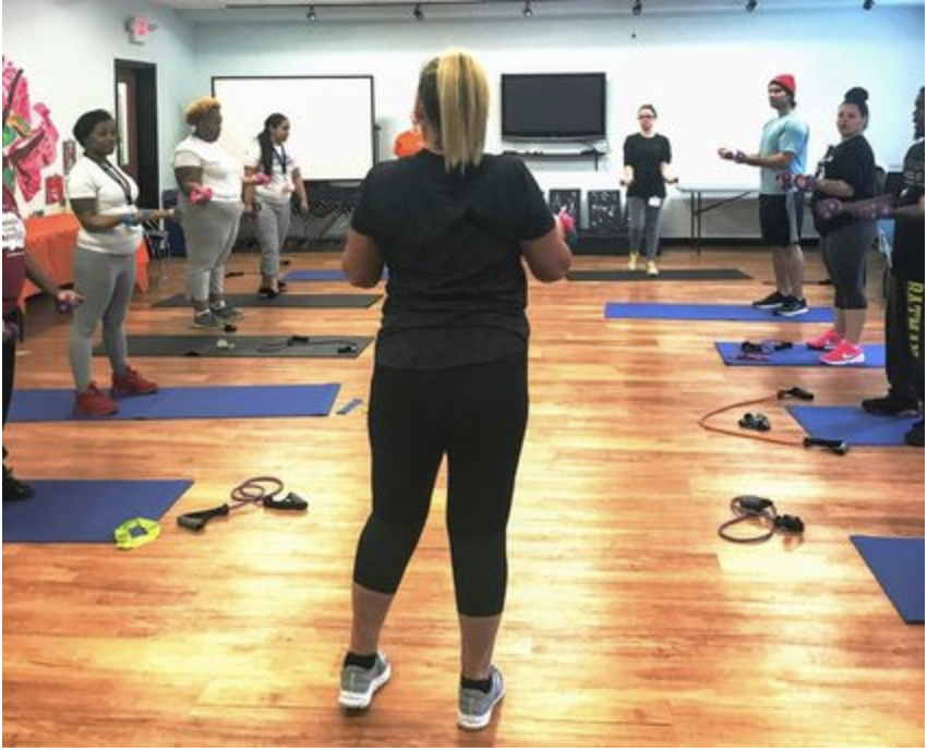 Center residents take part in a weekly fitness class as part of the new fitness incentive program.