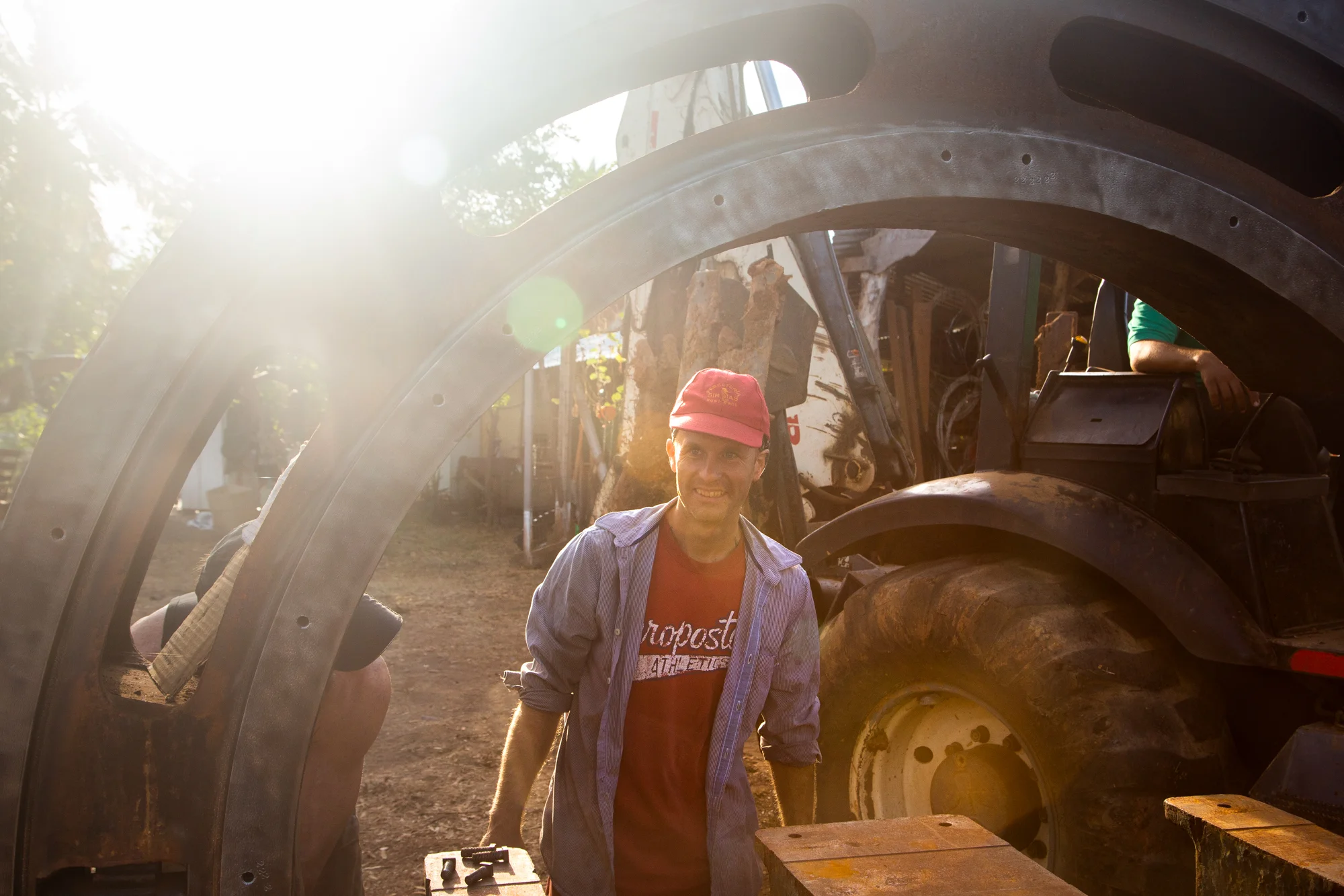 Co-founder of the shipyard Association, Lynx Guimond works to re-position our specialized tilting ships’ saw. Photo: Jeremy Starn.