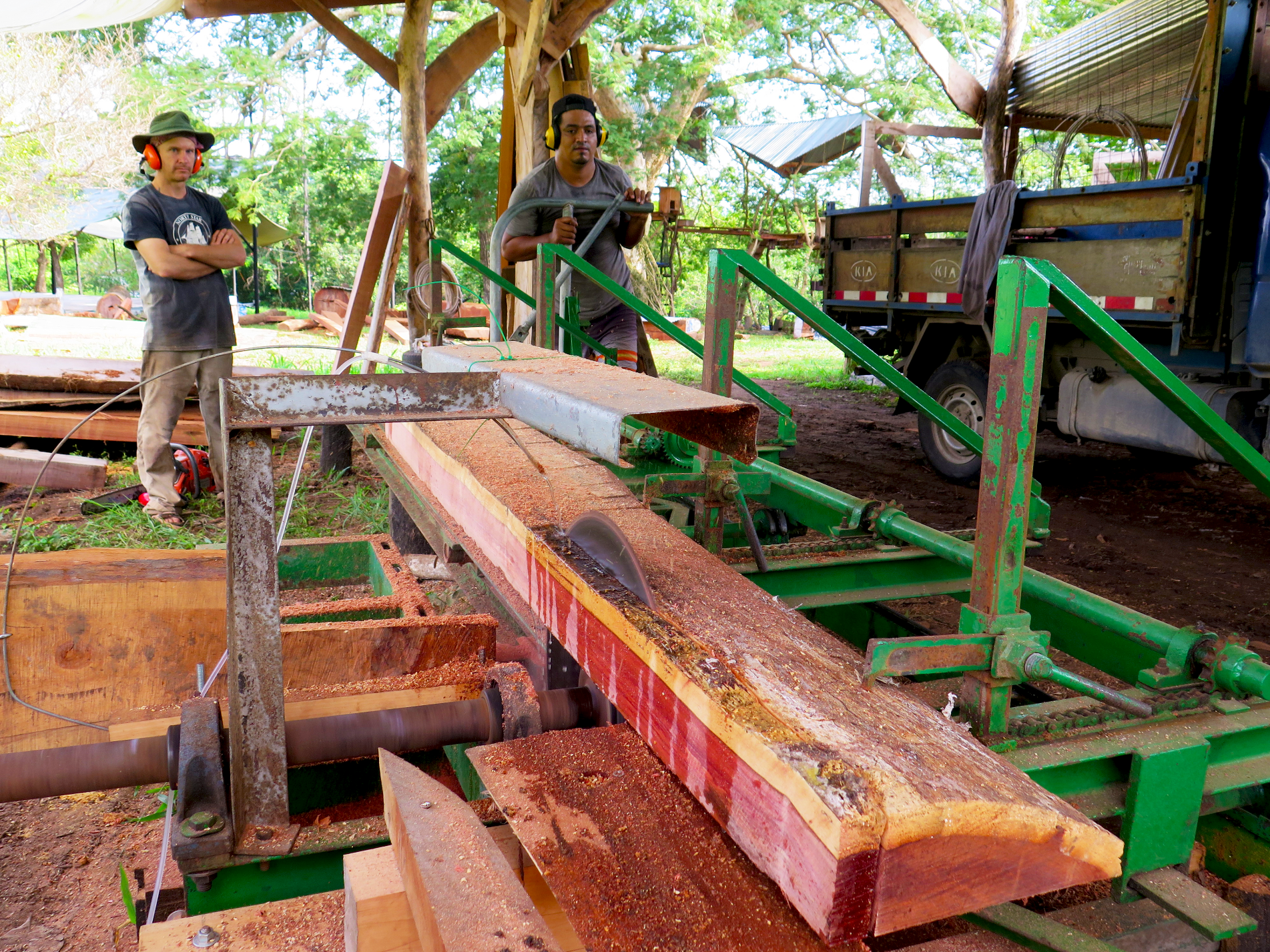 Lynx and Francisco work the fixed-blade sawmill, which is capable of ripping the densest hardwoods in the world. Shown on the sawmill is Tamarindo del Monte (Latin: dialium guianese ), which was naturally wind-fallen by Hurricane Otto in Bijagua, Northern Costa Rica. Photo: Danielle Doggett.