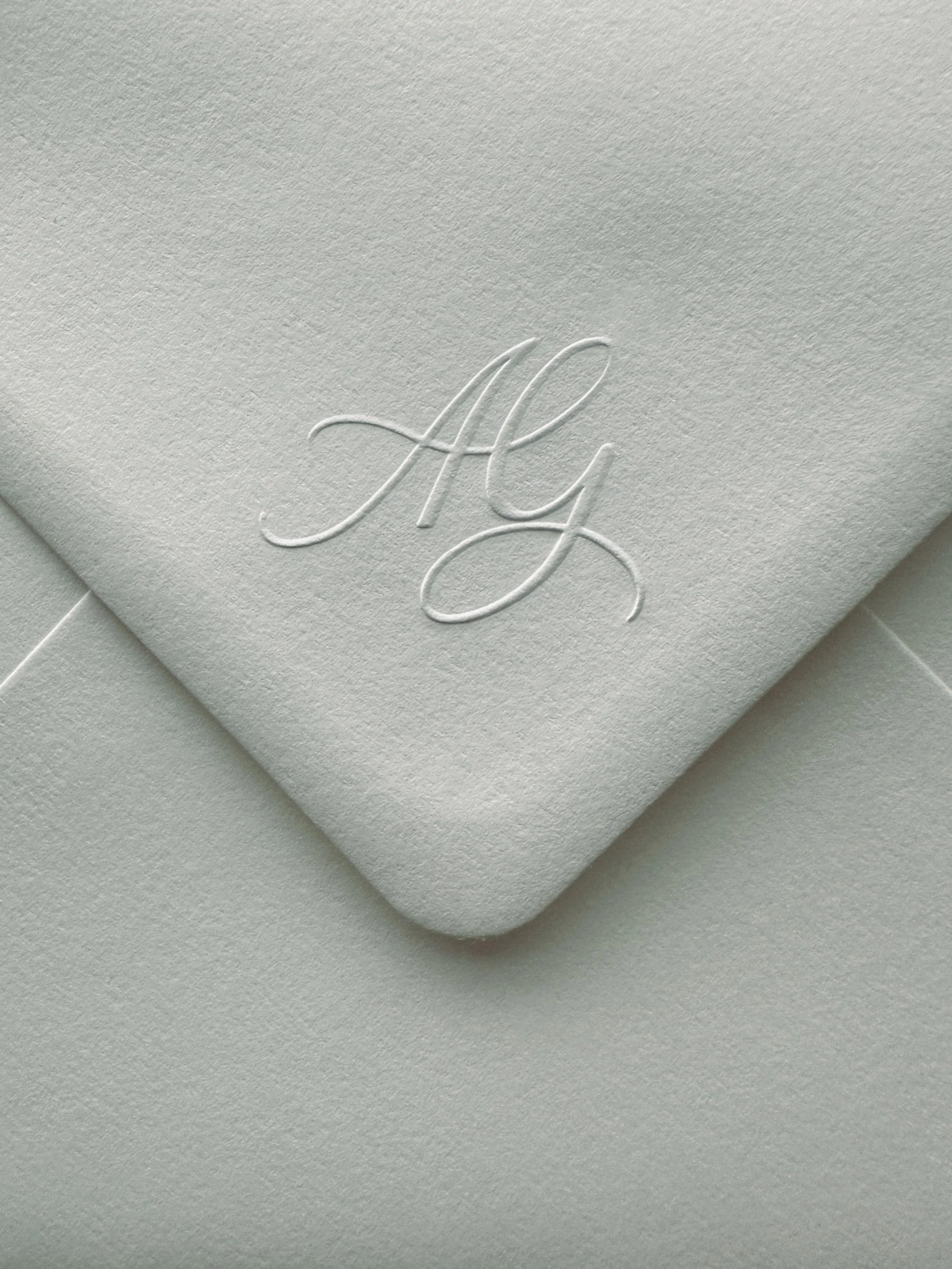 Bespoke monogram designed for A &amp; G and embossed on their invitation envelopes. A truly unique &amp; personal detail that becomes a part of a couple&rsquo;s &lsquo;wedding branding&rsquo; and can be used throughout the stationery. Thanks to @heir