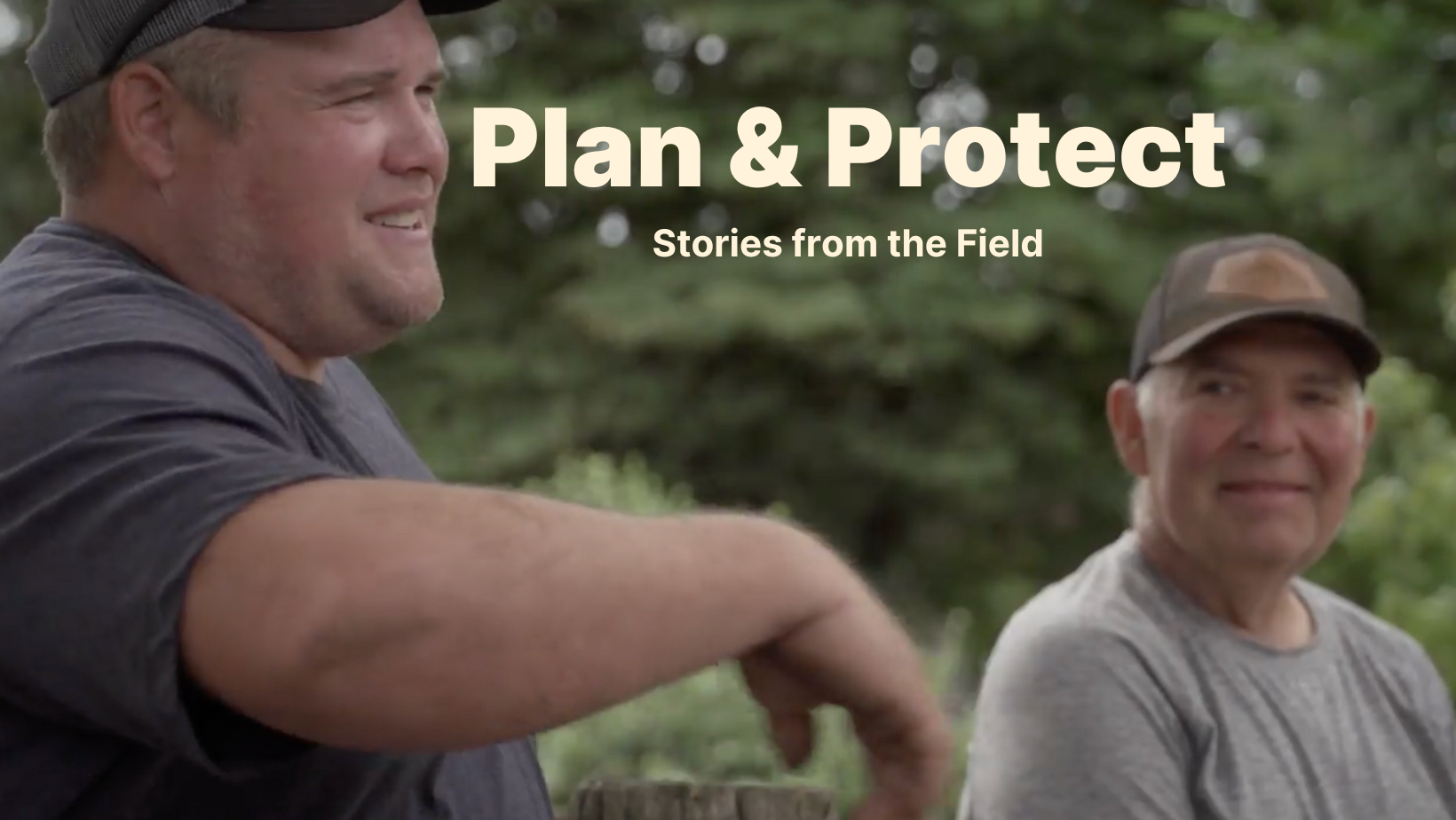 Alex Bergstrom and Lucien Gunderman of Crown Hill Farm talk near trees in their managed forest.