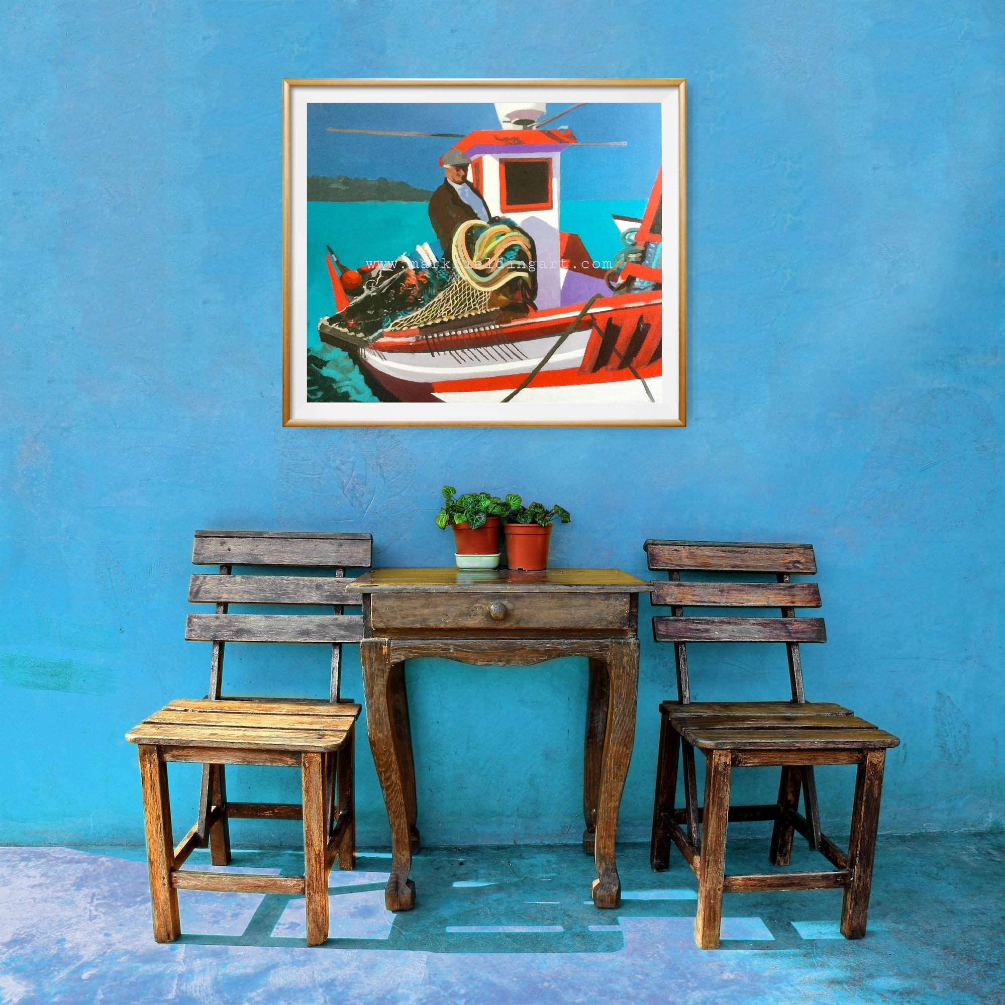 Framed print of Spanish fisherman on a blue wall.jpg