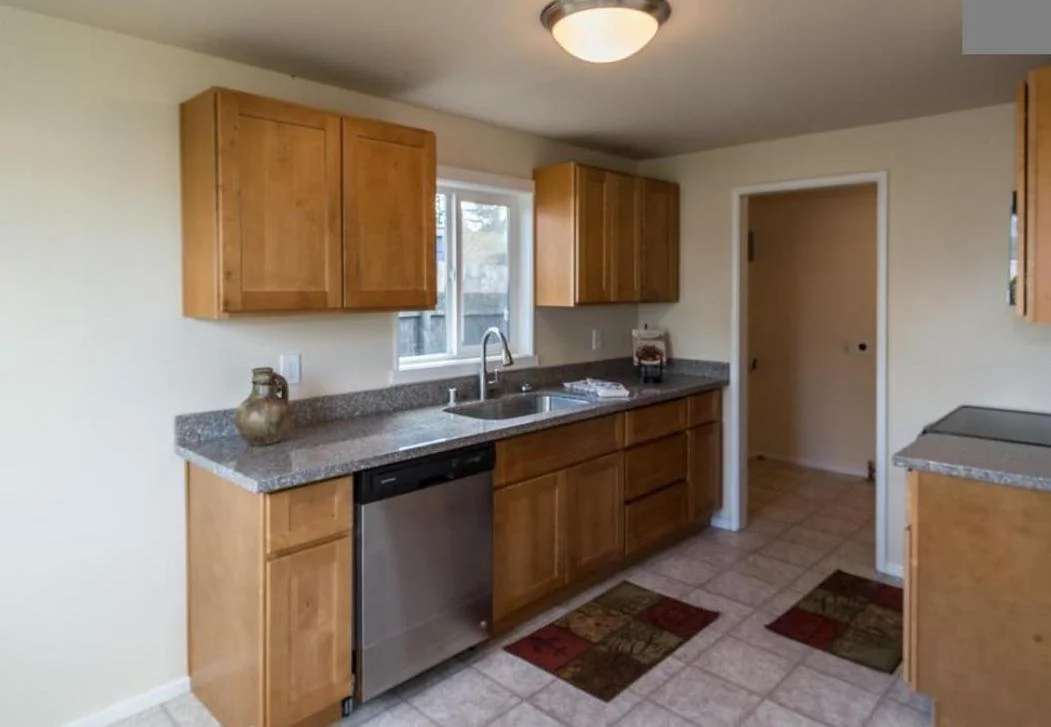 Newly installed kitchen with added dishwasher.