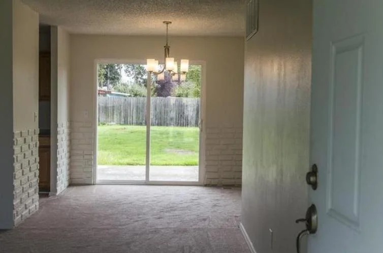 Vinyl flooring was installed in the kitchen &amp; carpet throughout the rest of the house including the living, dining &amp; bedrooms.