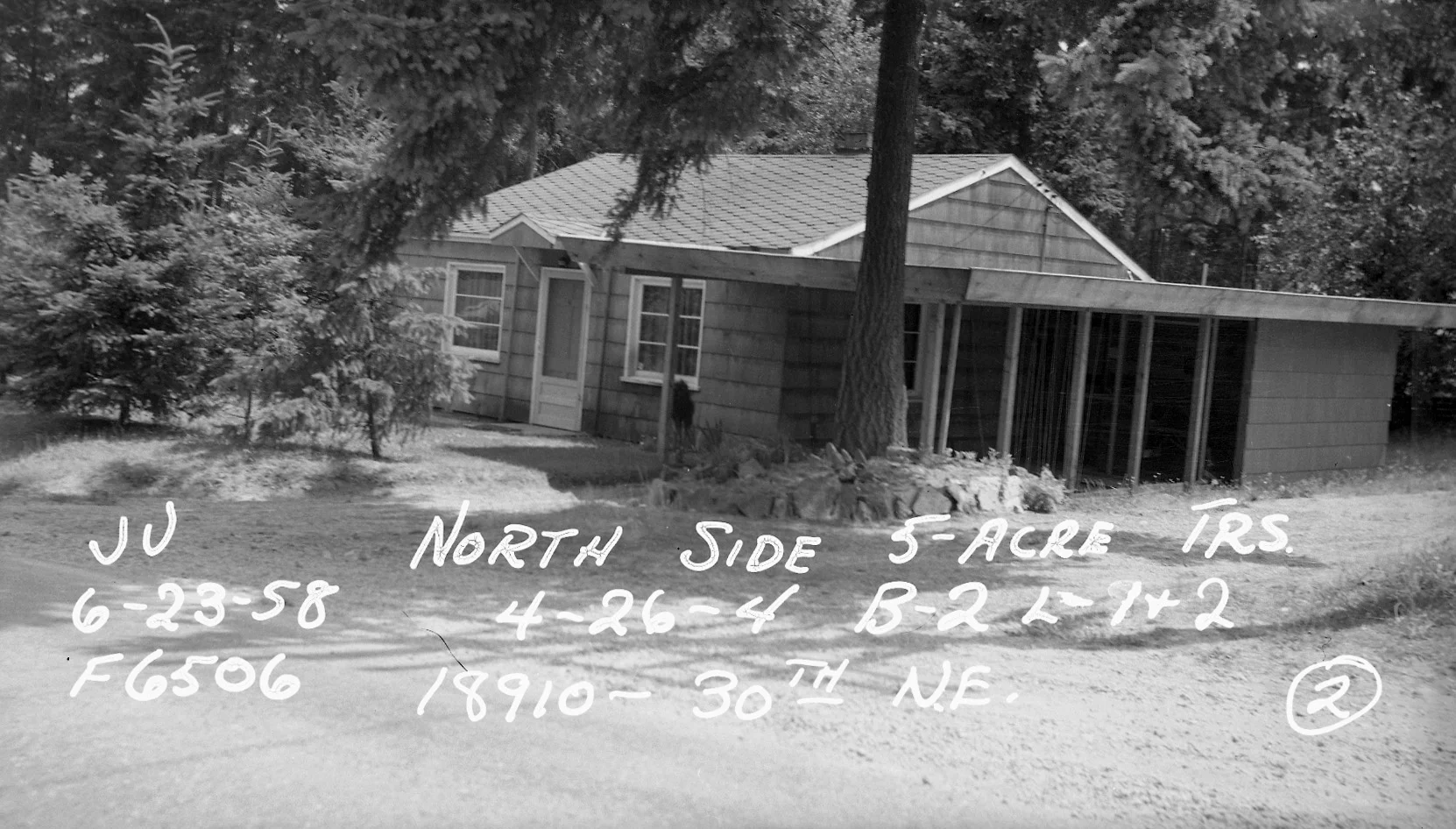 House in 1958 with carport added on west side with subject tree directly in front.