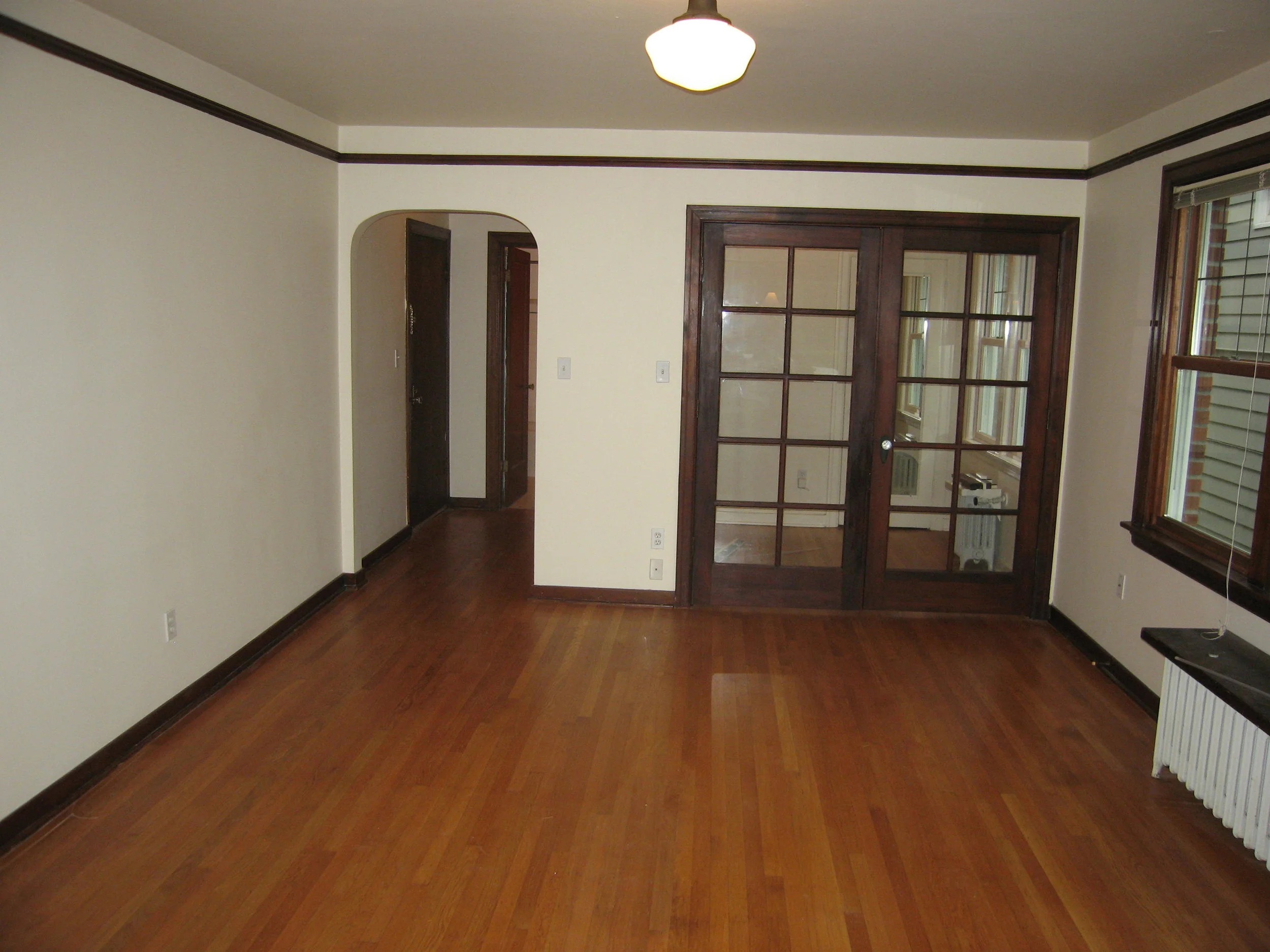 New doors in closed position. Attached rail curtains on the bedroom side can be closed for privacy.