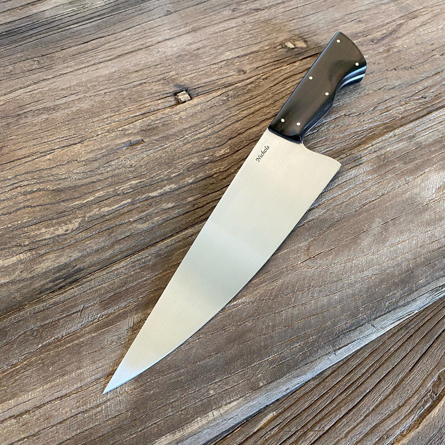 Finished this 8.5 inch chef knife! Blade is 52100 with ebony handles and stainless pins. I ground a nice thin flat grind with an aggressive distal taper to make it light and fast. Really happy with this piece! DM me if you want one like it!