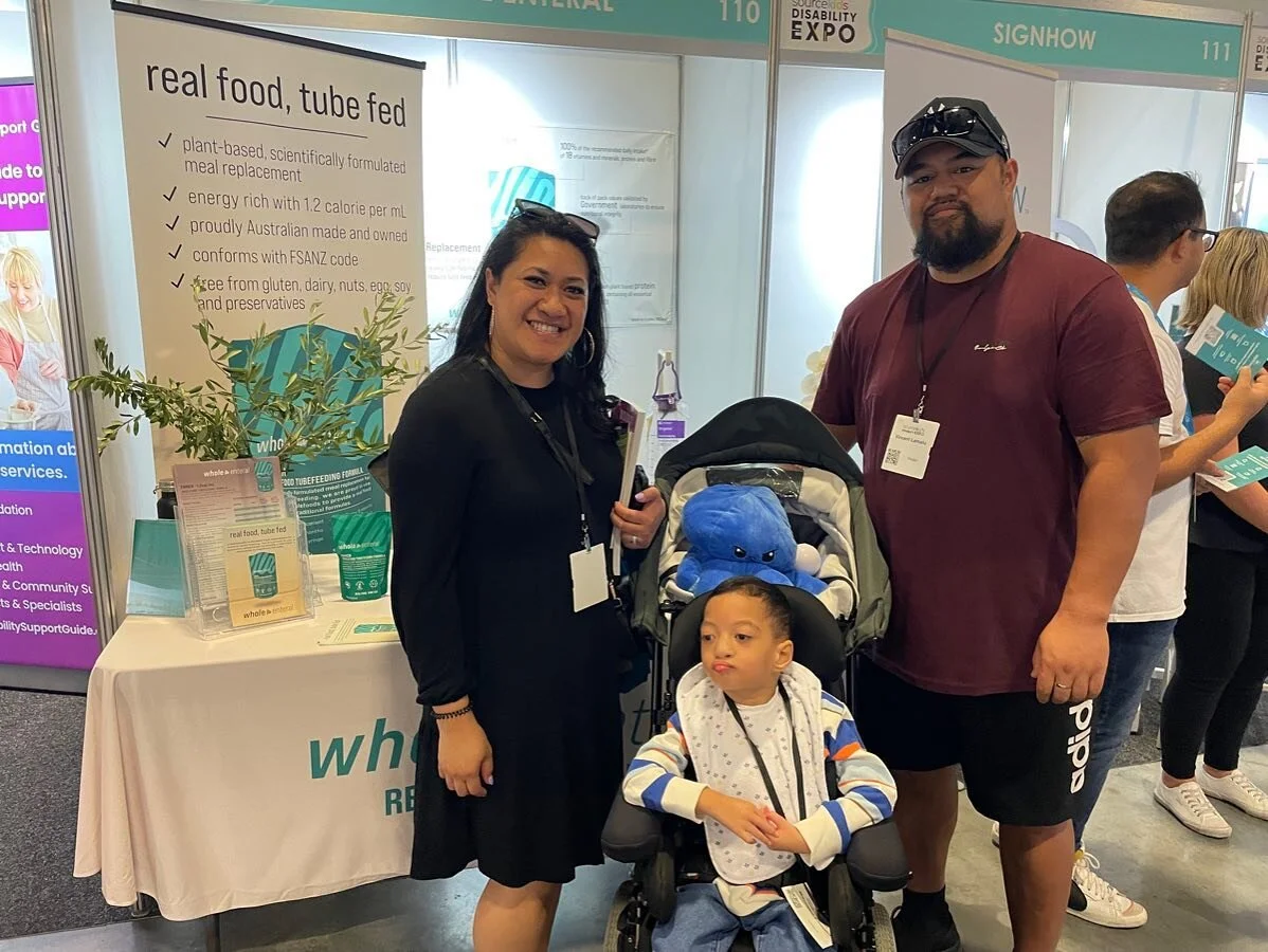The best part of going to expos? Meeting lovely customers in person and hearing their cupboards are full of Enrich and how happy they are with the product 🥰
ID: two parents and one child standing in front of the Whole Enteral Stand at the Source Ki