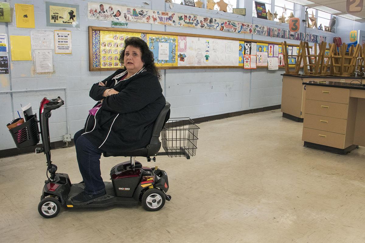 Language arts teacher Joey Spiers is moving from this classroom to one more accessible. In her 30 years at Howard W. Bishop Middle School, she said she has fended off squirrels running across the ceiling tiles and opossums nesting in science classrooms. Aaron Ritter / Alligator Staff