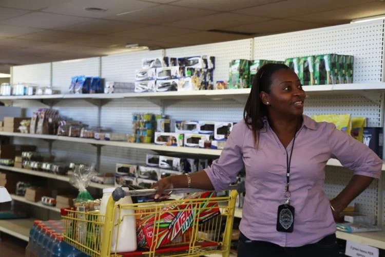 Pastor Crystal Griffin stops to talk to a friend while shopping for her ministry on Friday afternoon at the Bread of the Mighty Food Bank. The food bank distributes to five surrounding counties, including Alachua. Kelly Hayes / Alligator Staff