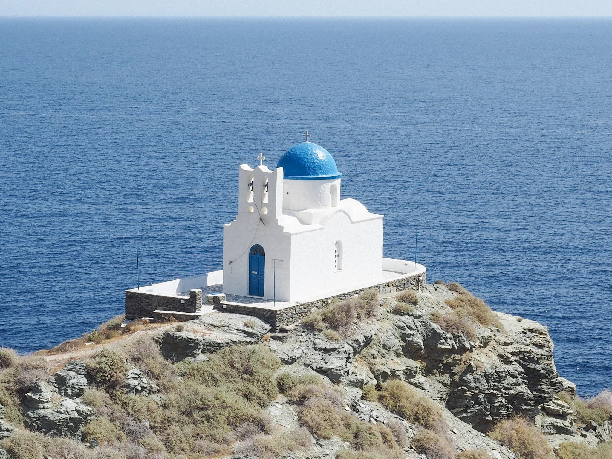 the church of the seven martyrs in Sifnos Greece with the Aegean around it