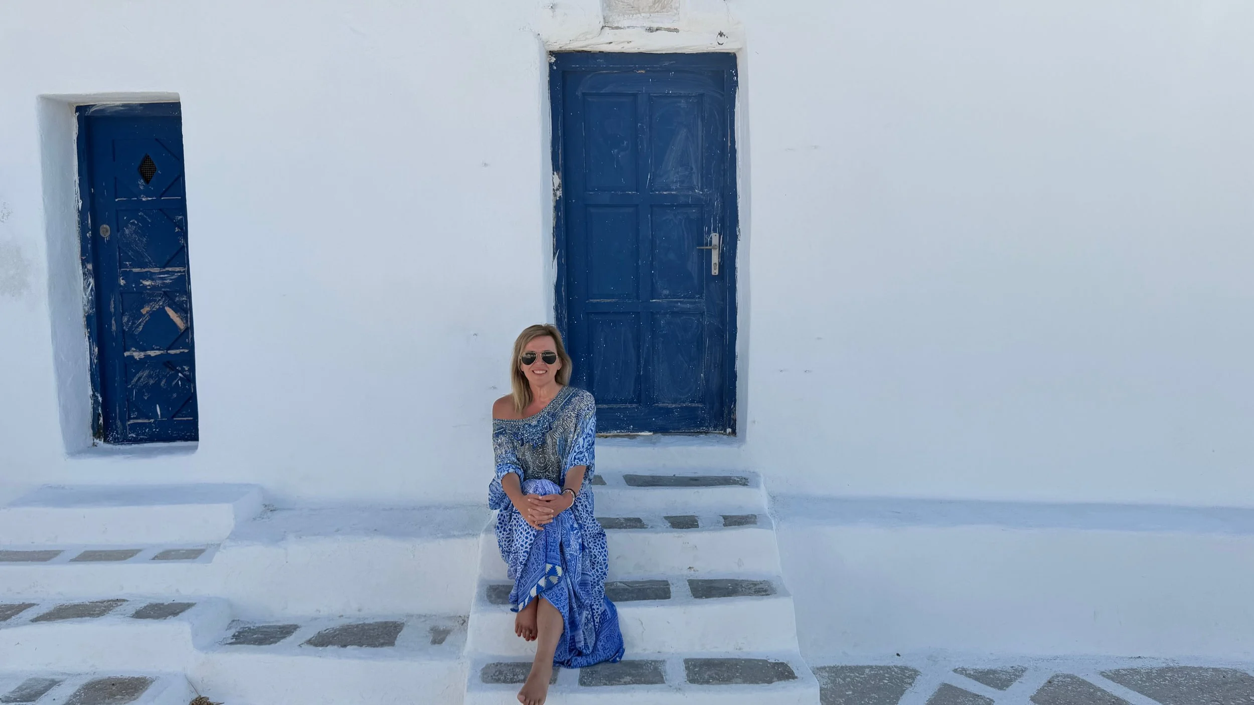 white washed walls blue door at Paros Greece monastery