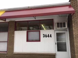 Look for the red awning!