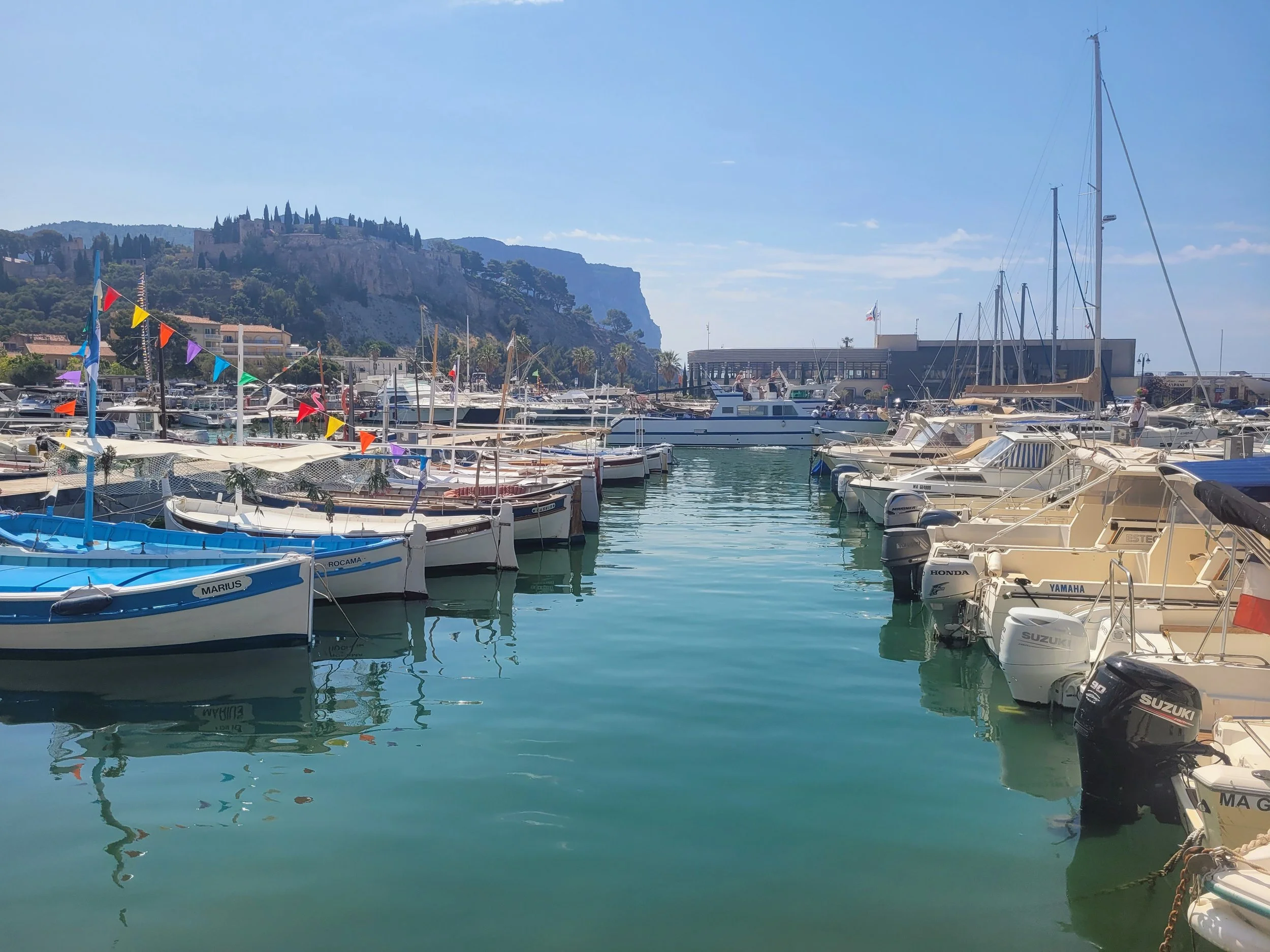 unlit fishing boats in Cassis harbor , Provence, France