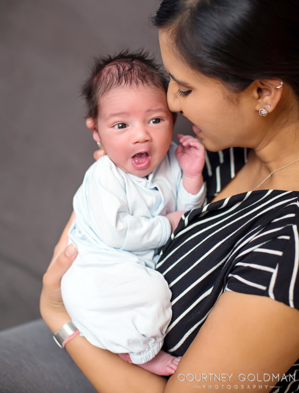 Smiling Indian Newborn Baby with her Mom