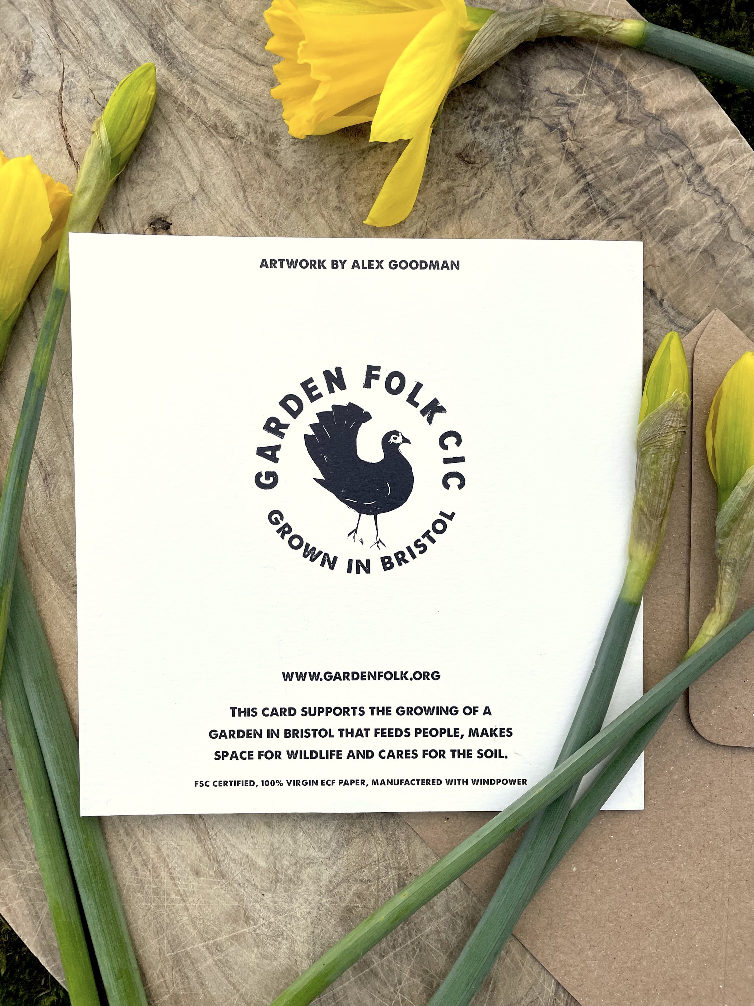 Linocut printed greetings card of a chicken and spring daffodils locally made in Bristol