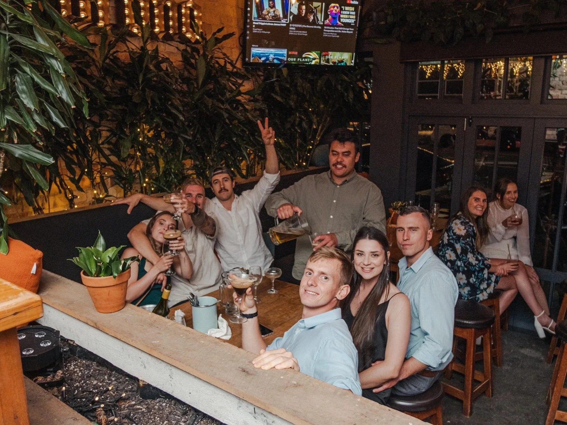 Work team celebrating together over drinks at Freeman & Grey in Ponsonby