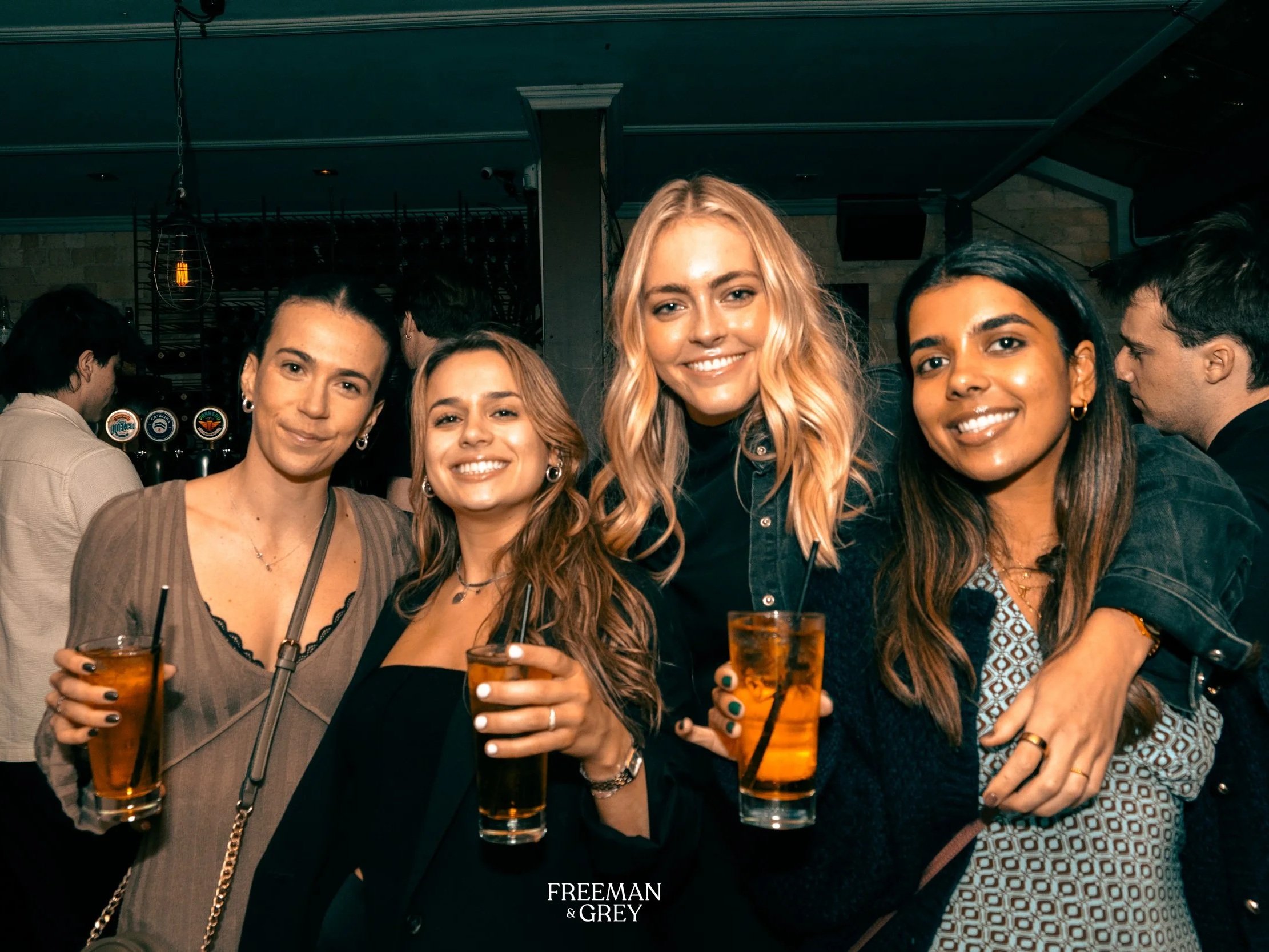 Friends enjoying drinks at a private party at Freeman & Grey in Ponsonby