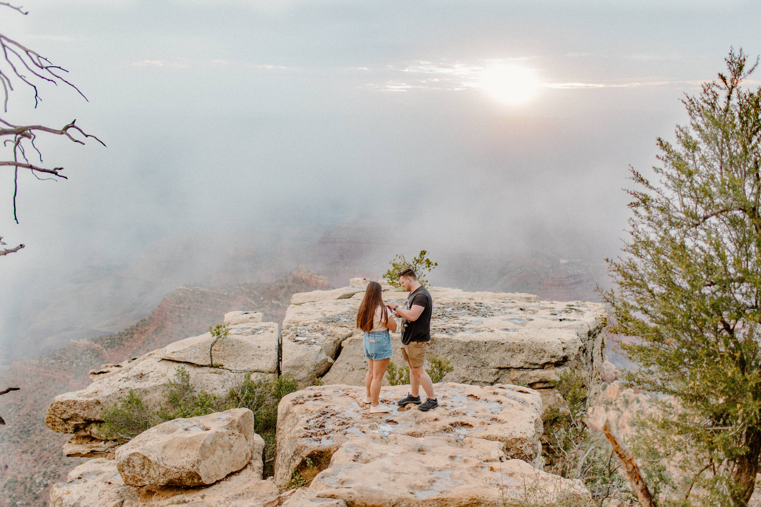  Surprise proposal at sunrise at the Grand Canyon. Man puts engagement ring on his new fiance’s finger after proposing at the rim of the Grand Canyon at Grandview Point. Grand Canyon engagement, Lucy B. Photography. 