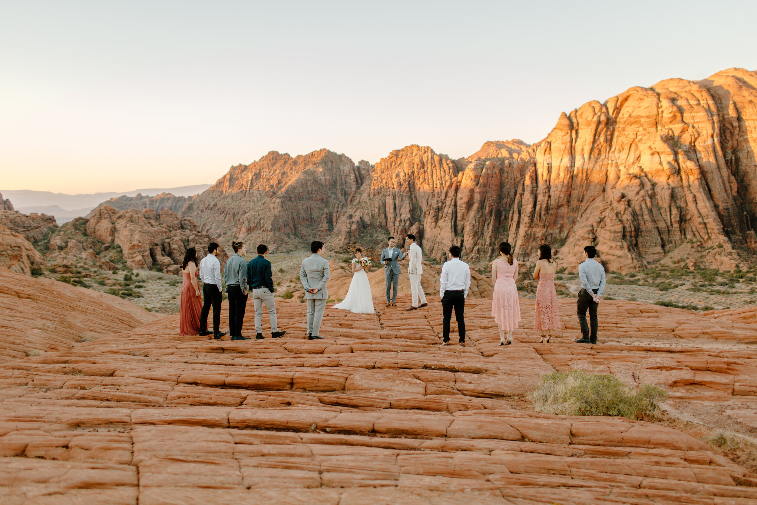  Wide shot of Utah elopement in a red rock landscape at Snow Canyon State Park in St. George Utah. Utah elopement photographer, Lucy B. Photography. 