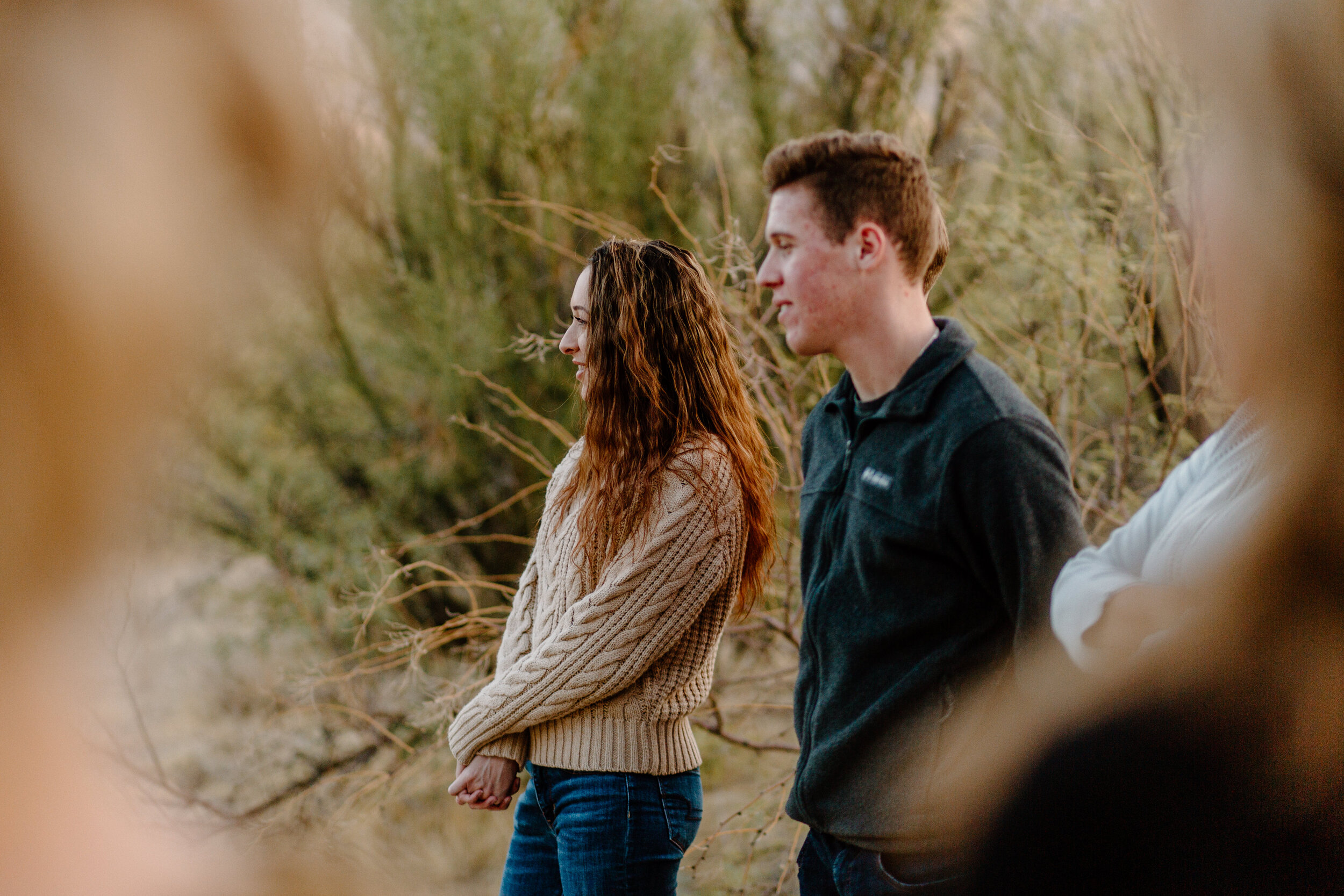  Close up of young adults watching their dad get married in Catalina State Park in Tucson. Tucson elopement photographer, Lucy B. Photography. 