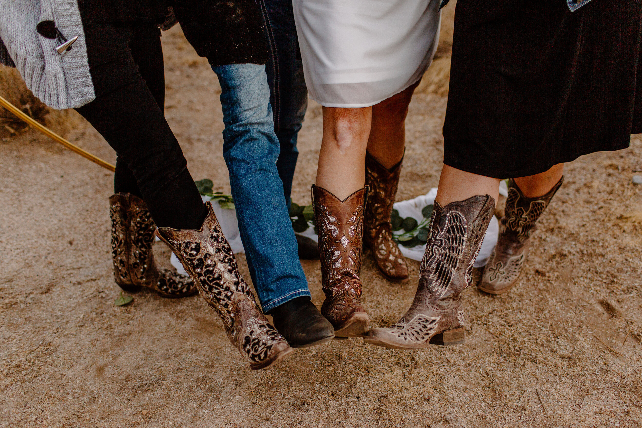  Close up photo of 4 women showing off their cowboy boots in Catalina State Park in Tucson. Tucson elopement photographer, Lucy B. Photography. 