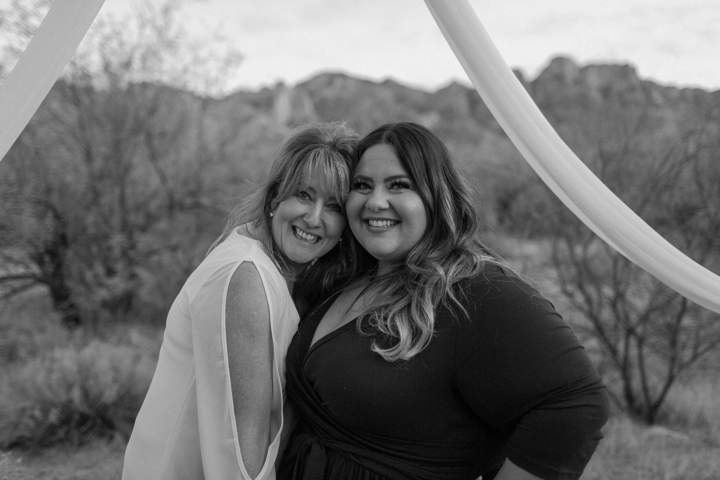  Bride poses with her daughter after her elopement ceremony in Catalina State Park in Tucson. Tucson elopement photographer, Lucy B. Photography. 