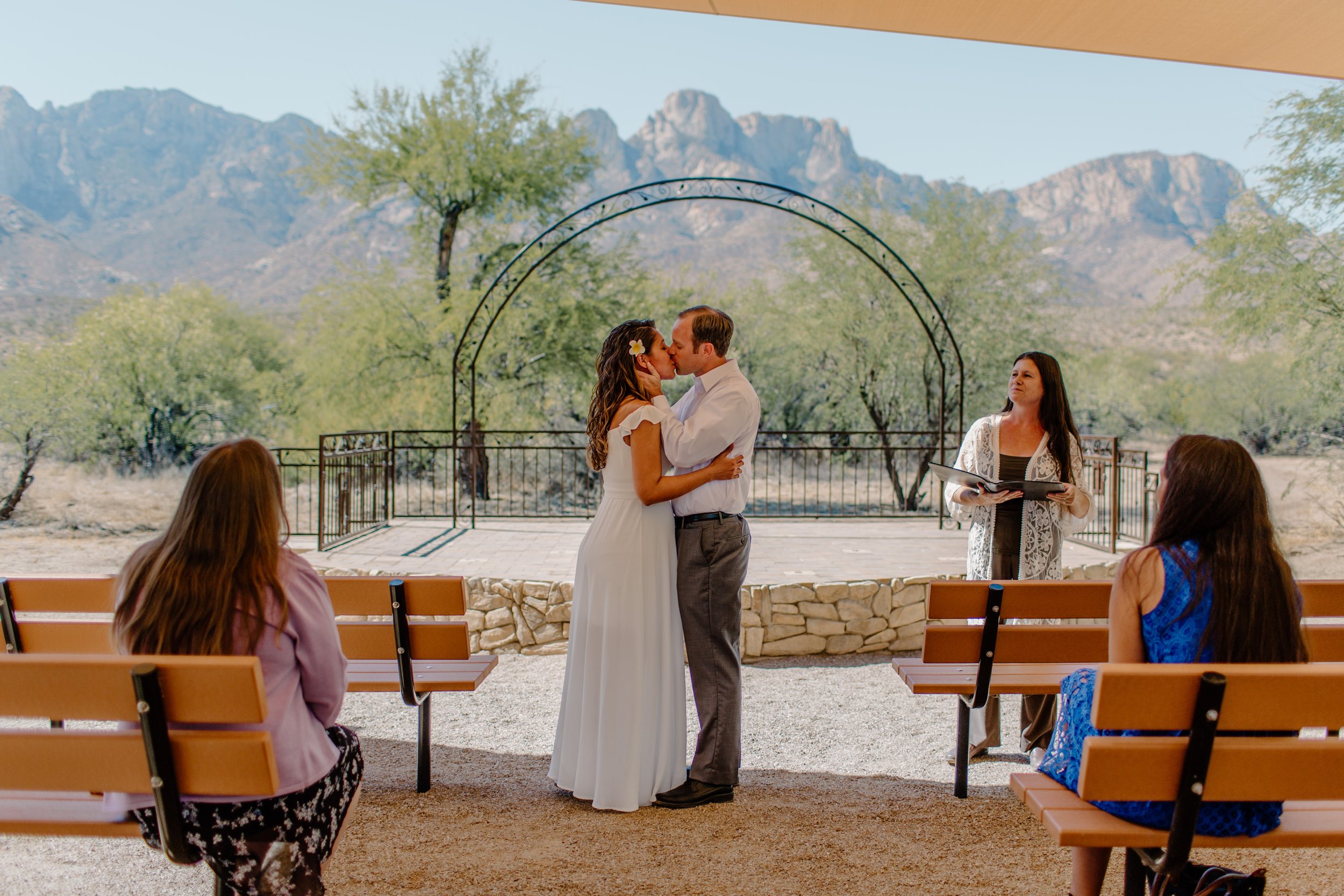  Couple shares their first kiss as a married couple as family watches at Catalina State Park in Tucson Arizona 