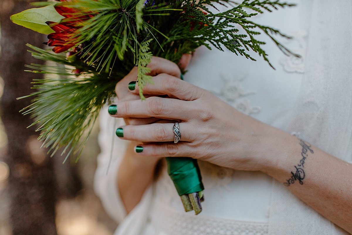  close up of wedding ring and blue nail polish on bride by Lucy Bouman   
