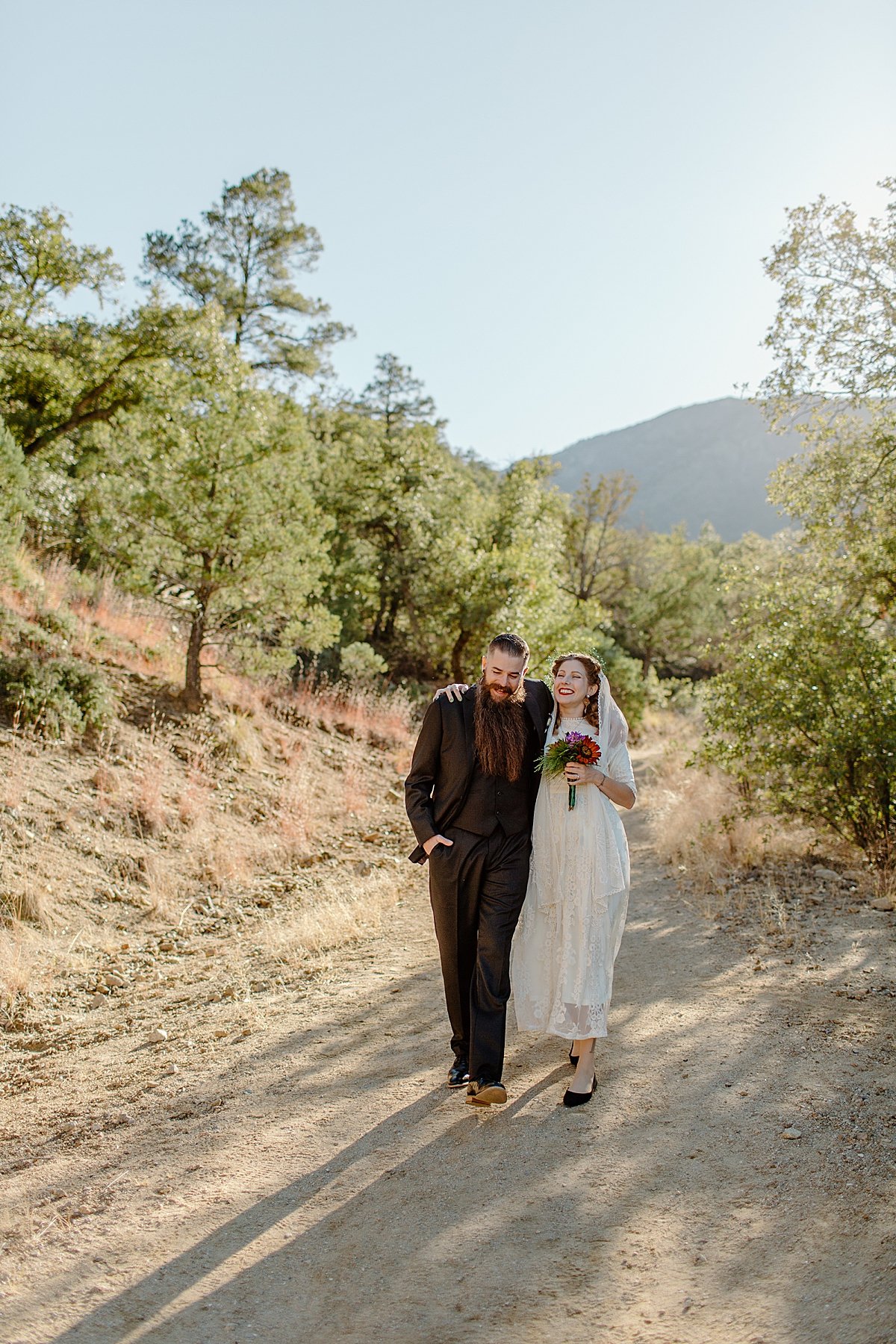  sunny skies in arizona on vow renewal day with bride and groom by elopement photographer   