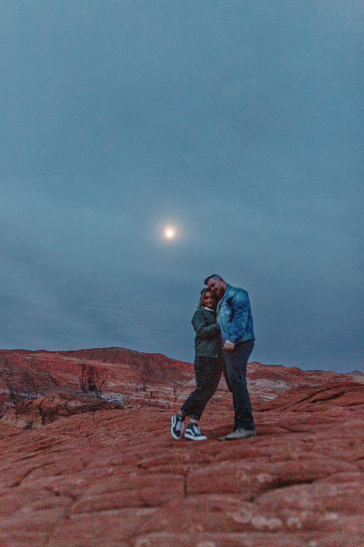  Utah adventure session at sunrise with couple wearing jean jackets and jeans  