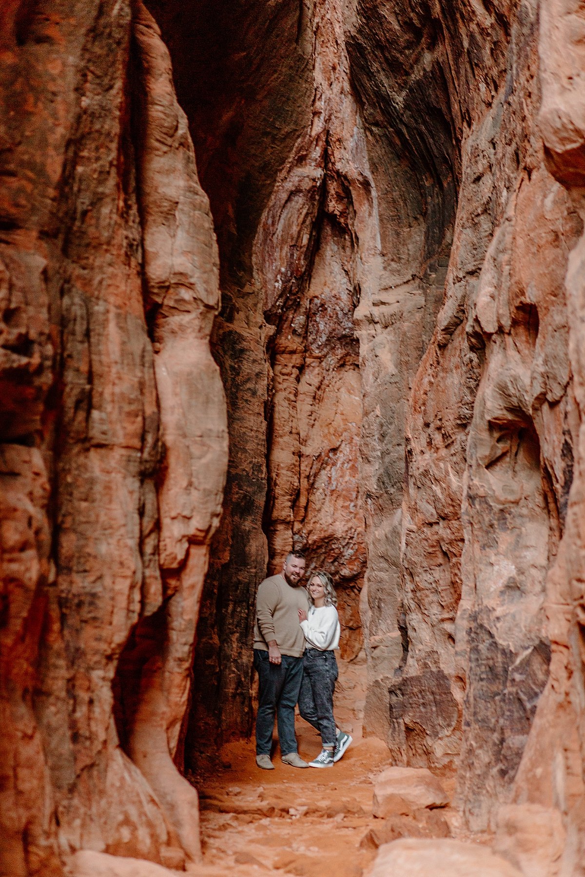  couple standing in the slot canyons with Utah couples photographer  