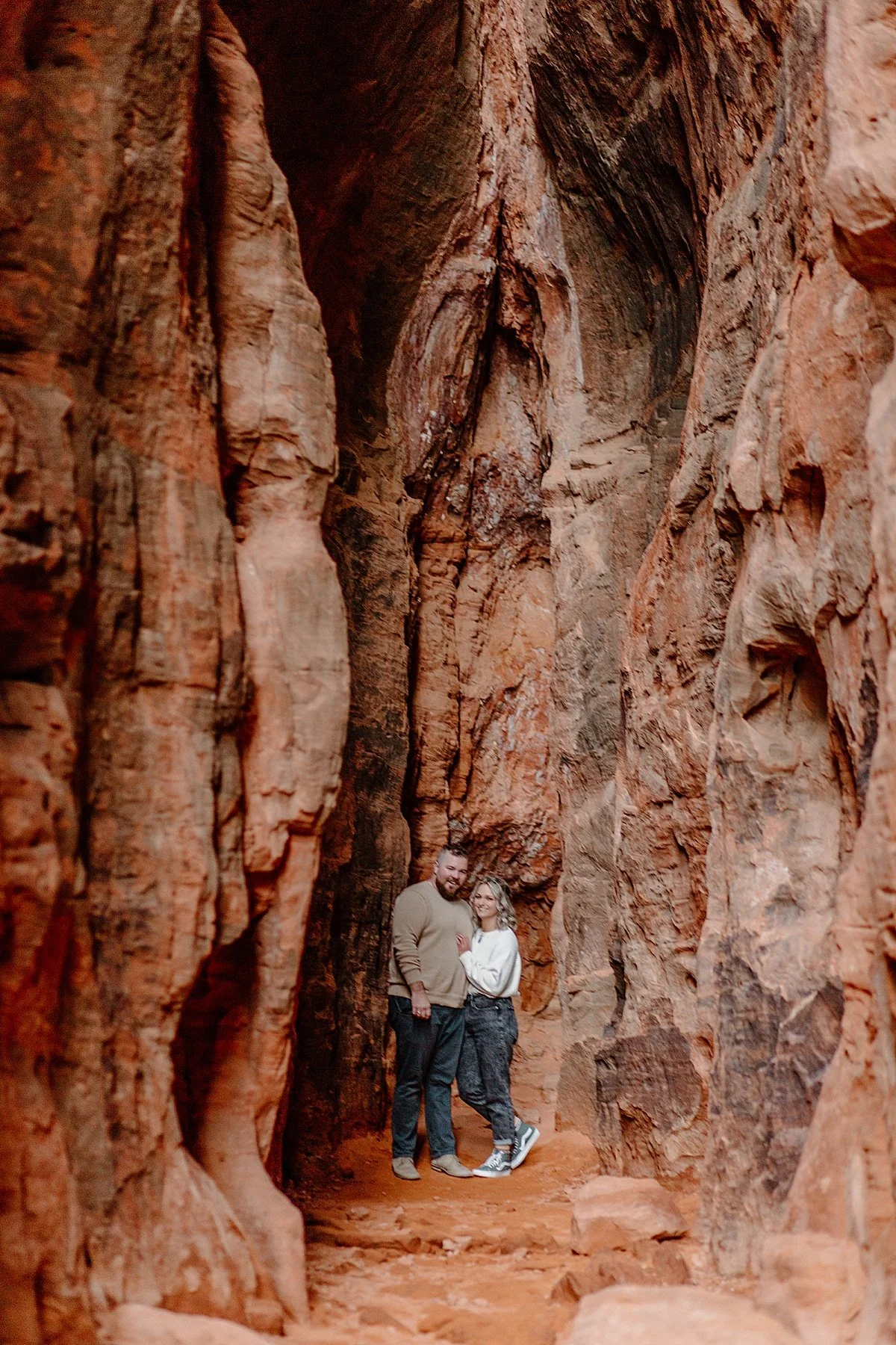  couple standing in the slot canyons with Utah couples photographer  