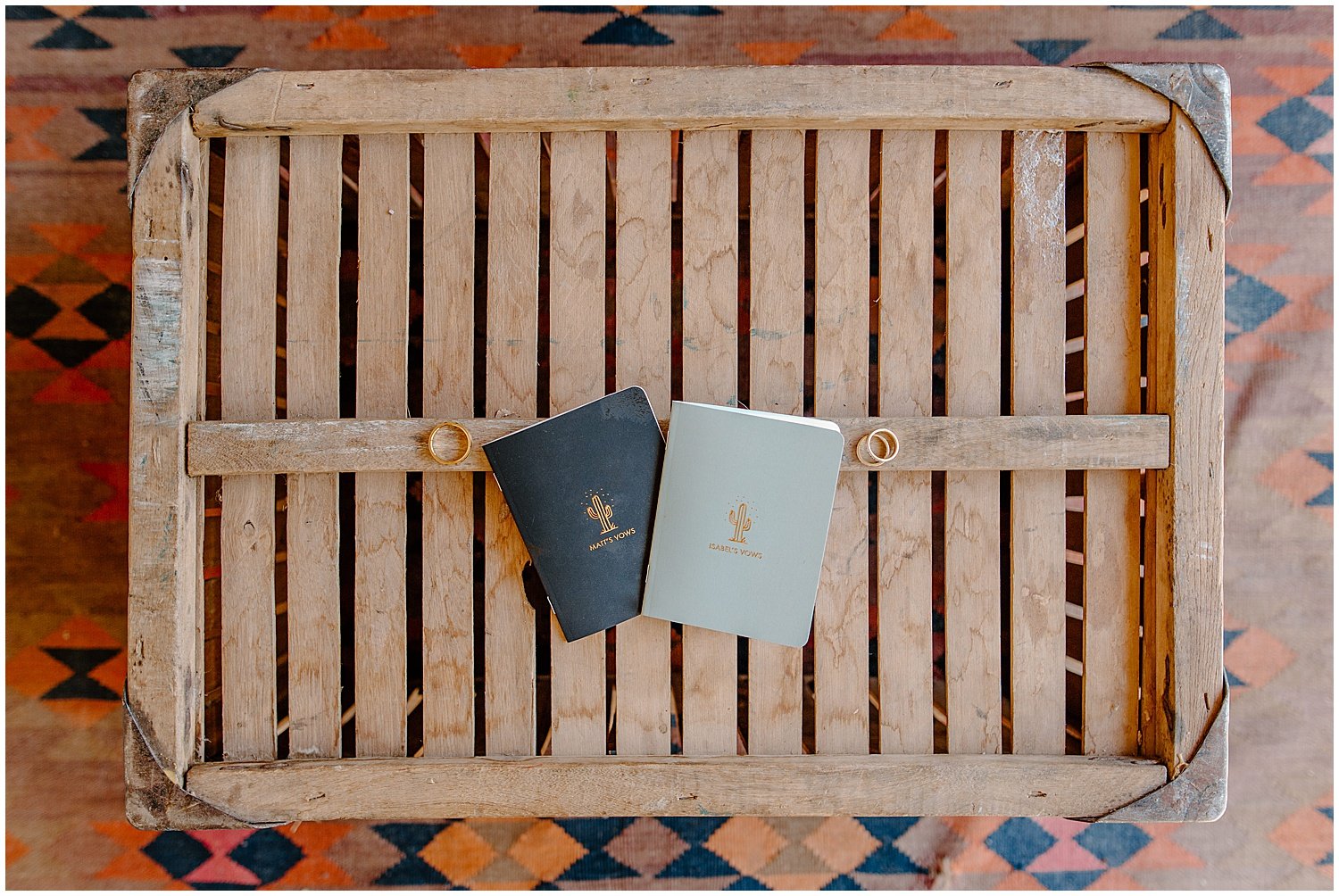  vow books on wood table with golden writing for Tucson Intimate Wedding 