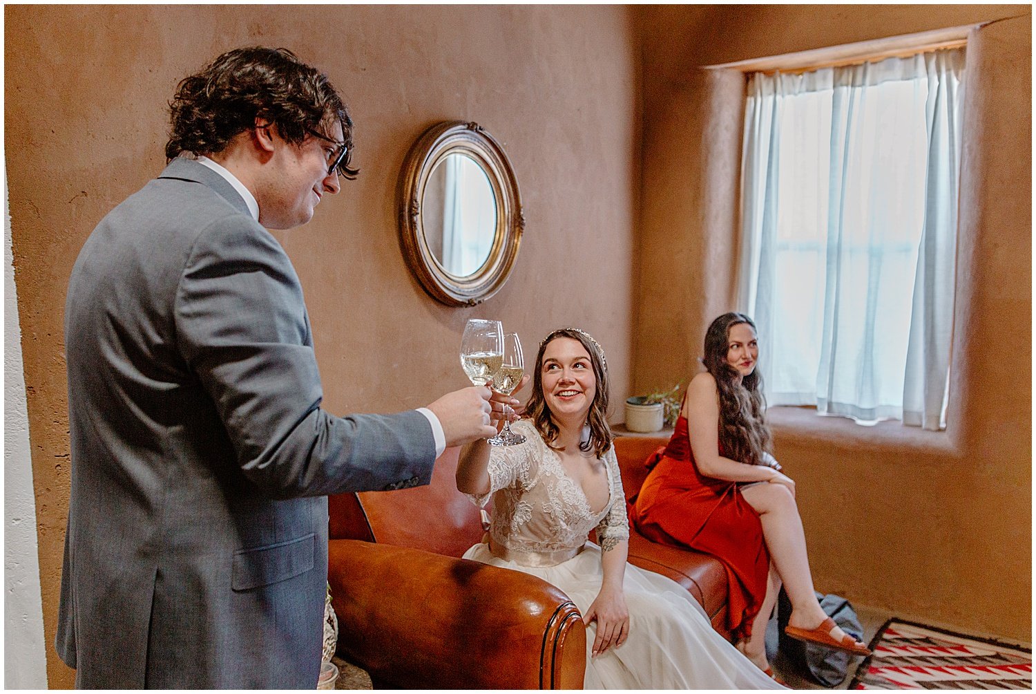  groom clinking glasses with friends and family before ceremony at Tucson Intimate Wedding 