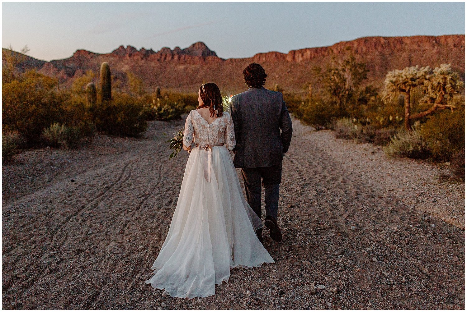  bride and groom walking away from photographer during Tucson Intimate Wedding 