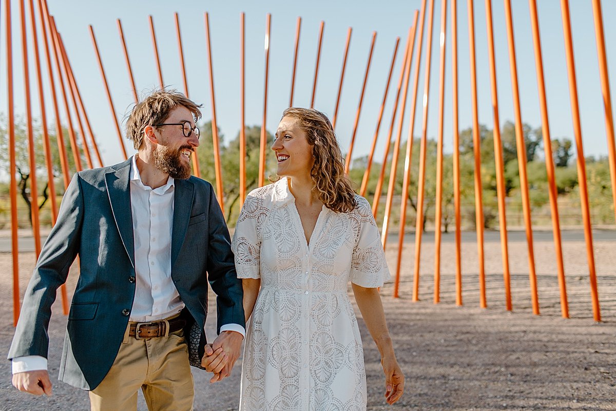  couple hip bumping one another at Tucson park by Lucy Bouman Photography  