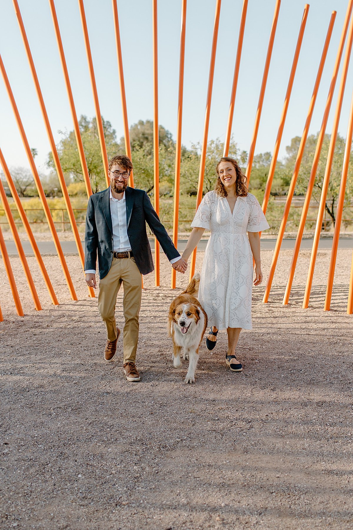  couple walking their dog in Tucson park by Lucy Bouman Photography  