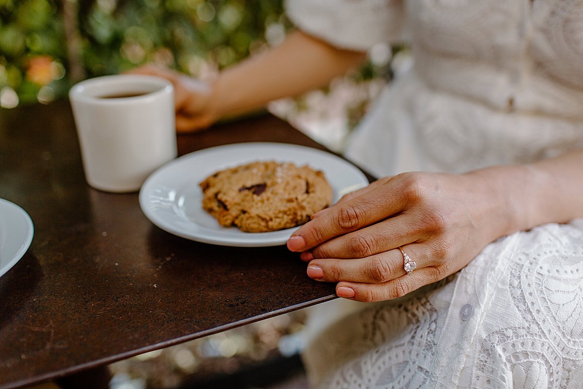  woman eating cookie at diner in Tucson with Arizona couples photographer 