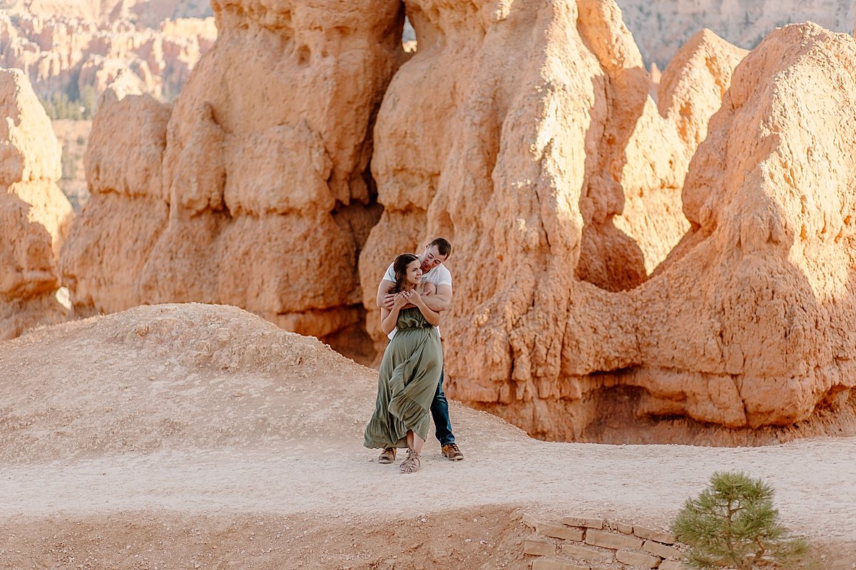  Couple standing on rocks in Utah for Bryce Canyon adventure session 