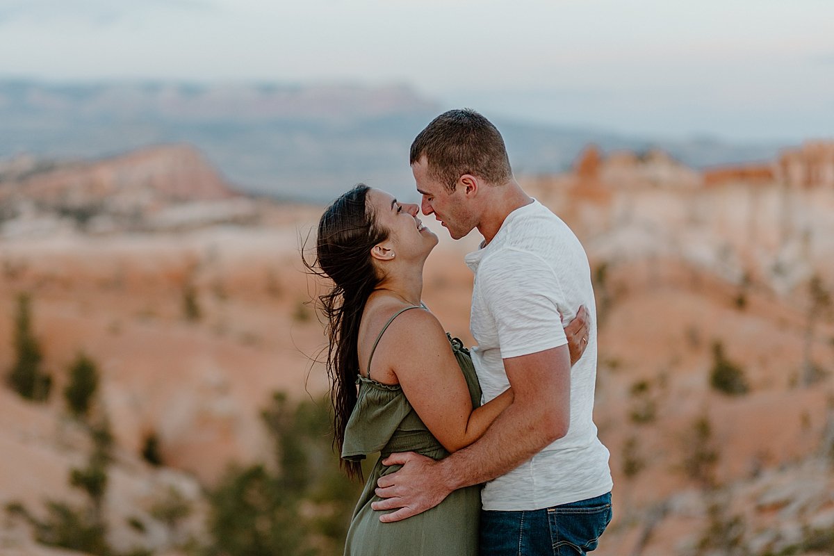  Engaged couple overlooking bryce canyon during engagement session with Utah couples photographer 